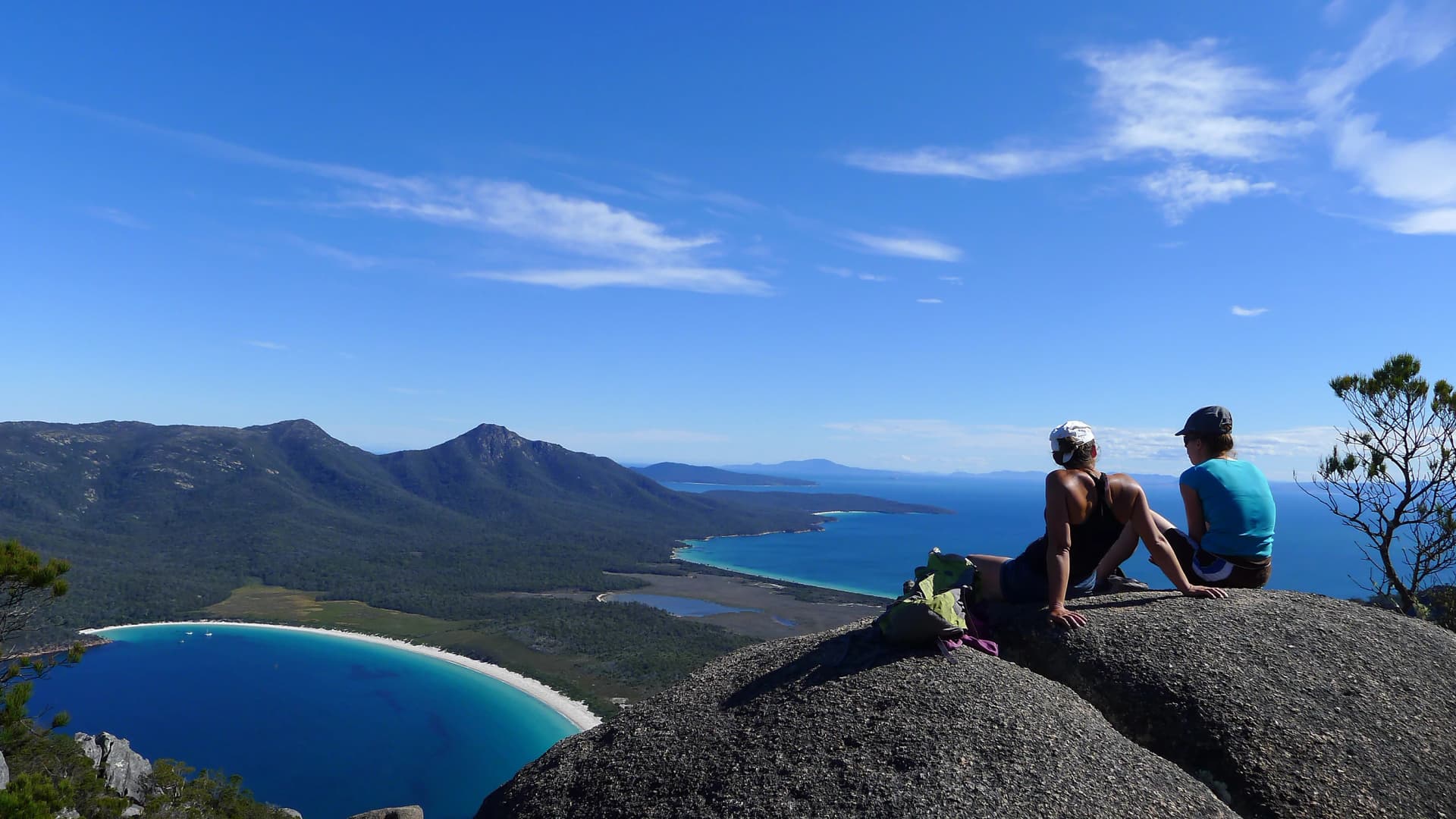 Walkers on Mount Amos above Wineglass Bay